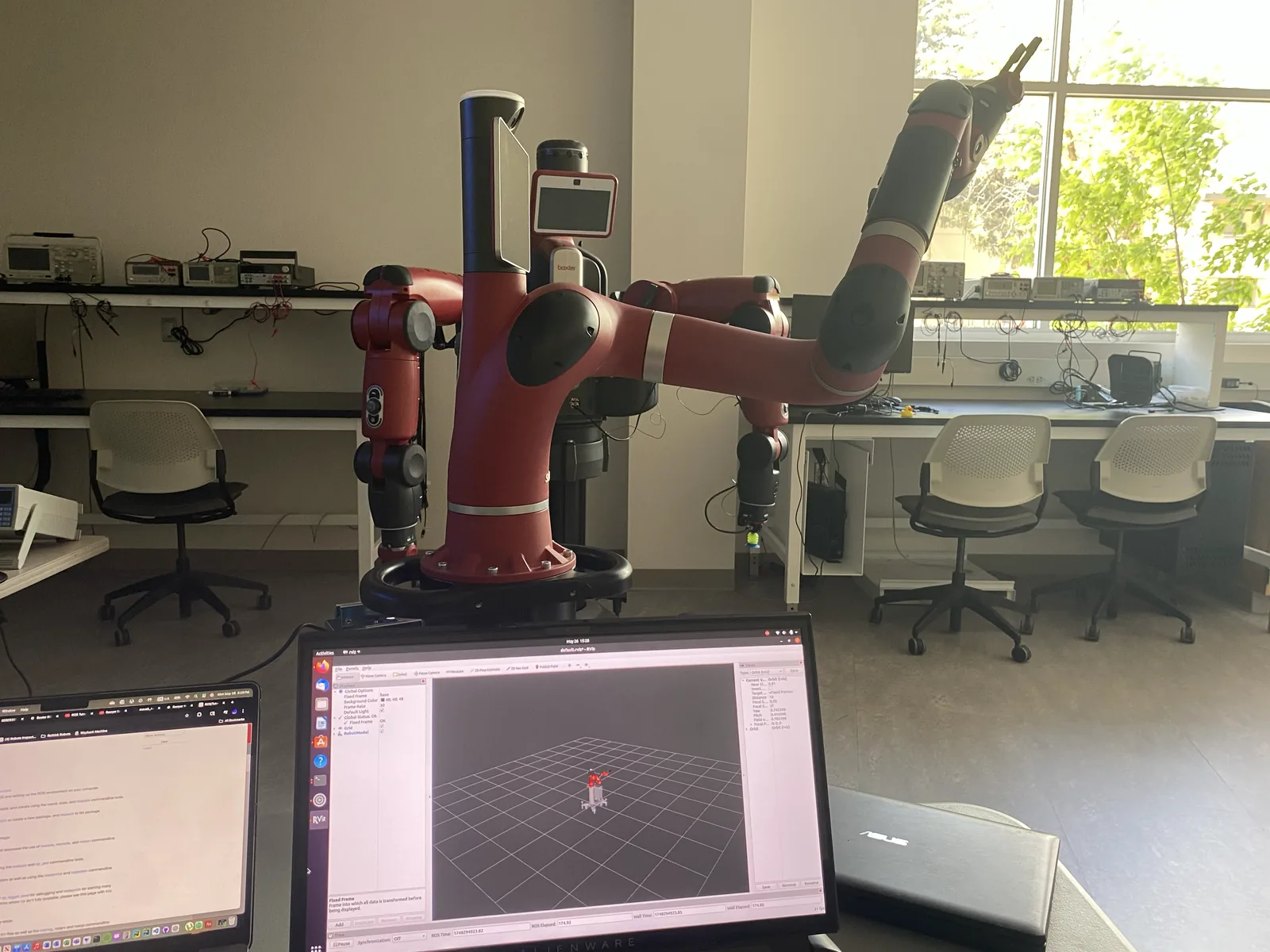 Baxter robot alongside its RViz motion-planning visualization